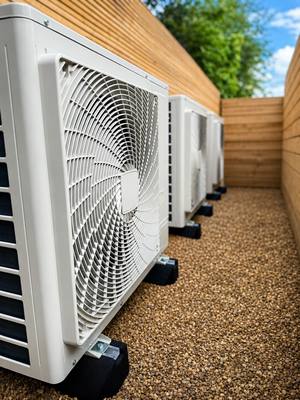 Daikin outdoor air conditioning condenser units installed outside a residential property