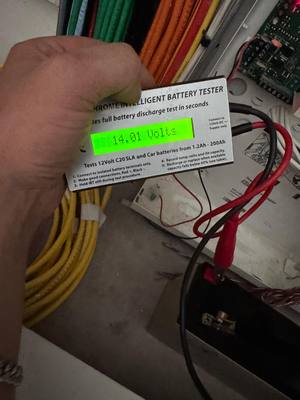Testing fire alarm system backup battery with an intelligent battery tester