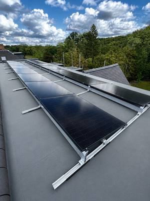 Residential solar PV panel array installed on a pitched roof
